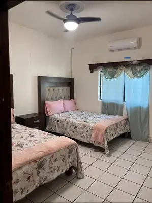 Cama o camas de una habitación en Flores Condominios Casa Narciso