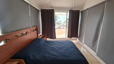 Cama o camas de una habitación en Casa a pie de playa isla de la piedra