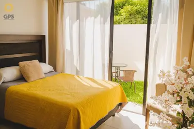 Cama o camas de una habitación en Agradable depa cerca del malecón by G P S rentas