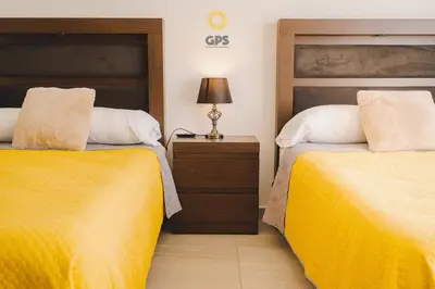 Cama o camas de una habitación en Agradable depa cerca del malecón by G P S rentas