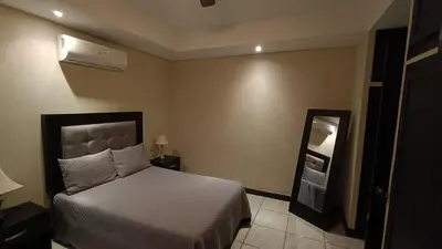 Cama o camas de una habitación en Suites Entrelagos