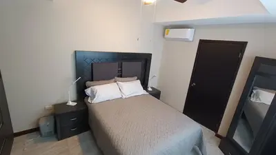 Cama o camas de una habitación en Suites Entrelagos