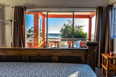 Cama o camas de una habitación en Casa Belen - Beautiful Beach View Home on Stone Island