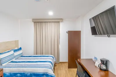 Cama o camas de una habitación en Hotel Pacific Blue Mazatlan
