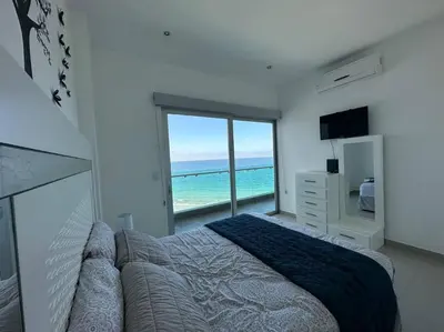 Cama o camas de una habitación en Torre EME 414 Vista al Mar