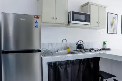 Una cocina o zona de cocina en Hermoso departamento a 5 min de Zona Dorada
