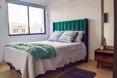 Cama o camas de una habitación en Hermosa y acogedora casa en comunidad privada