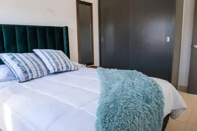 Cama o camas de una habitación en Hermosa y acogedora casa en comunidad privada