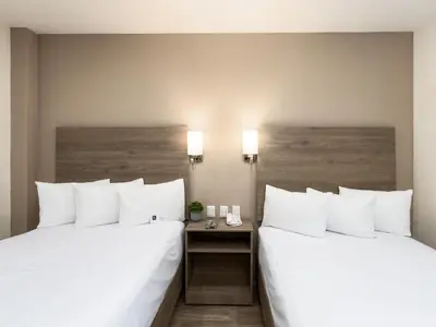 Cama o camas de una habitación en Hotel Mesaluna Short & Long Stay