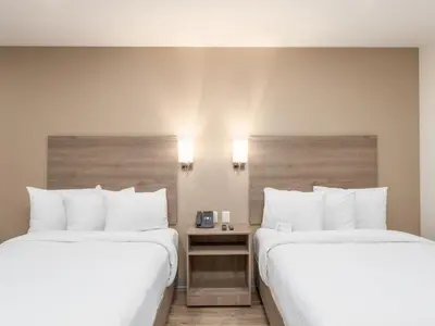 Cama o camas de una habitación en Hotel Mesaluna Short & Long Stay